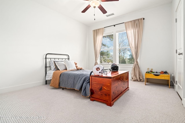 carpeted bedroom with ceiling fan