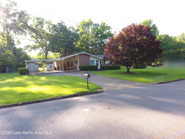 240 Windsor Dr, Alexander City, AL 35010 - view of front of home featuring driveway, an attached carport, and an outdoor structure
