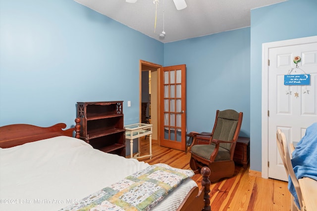 bedroom featuring light wood-type flooring and ceiling fan