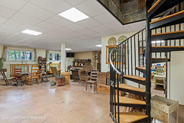 interior space featuring a drop ceiling