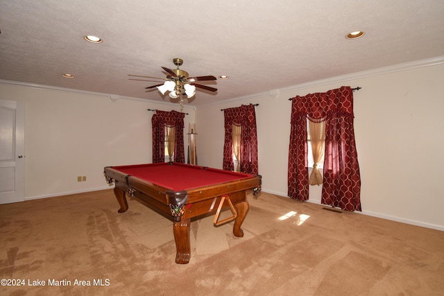 recreation room with ceiling fan, ornamental molding, and carpet floors