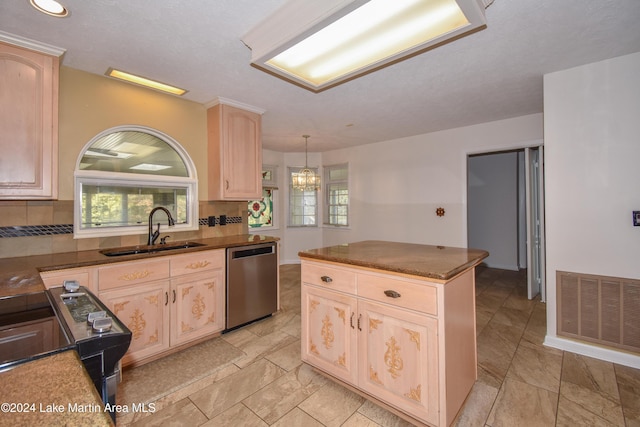 kitchen featuring dishwasher, sink, backsplash, pendant lighting, and light brown cabinetry