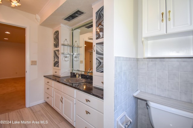 bathroom with hardwood / wood-style floors, vanity, toilet, and tile walls