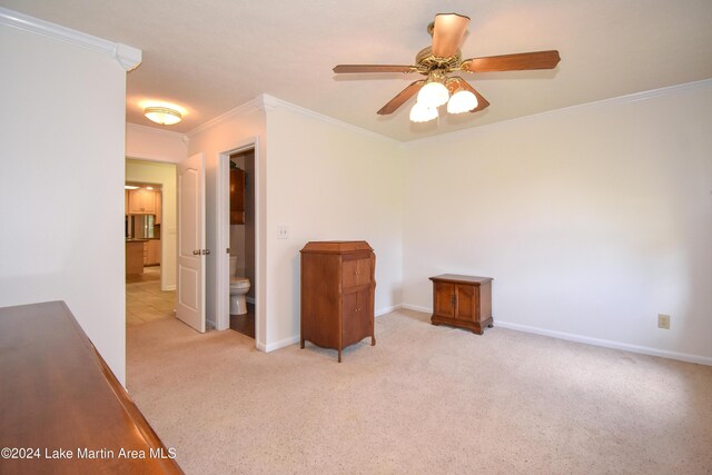 empty room with light carpet, ceiling fan, and ornamental molding