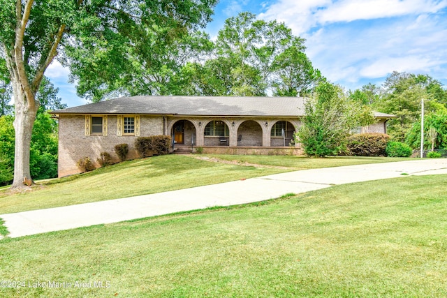 ranch-style house with a front lawn