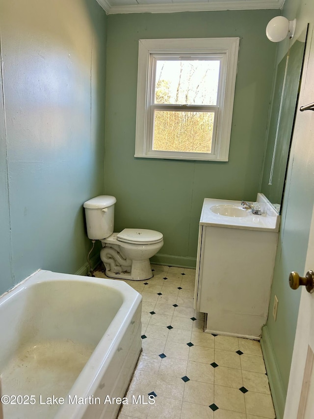 bathroom with toilet, vanity, and a tub to relax in