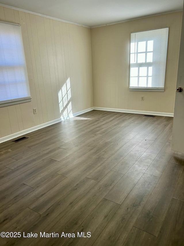 spare room featuring dark wood-type flooring