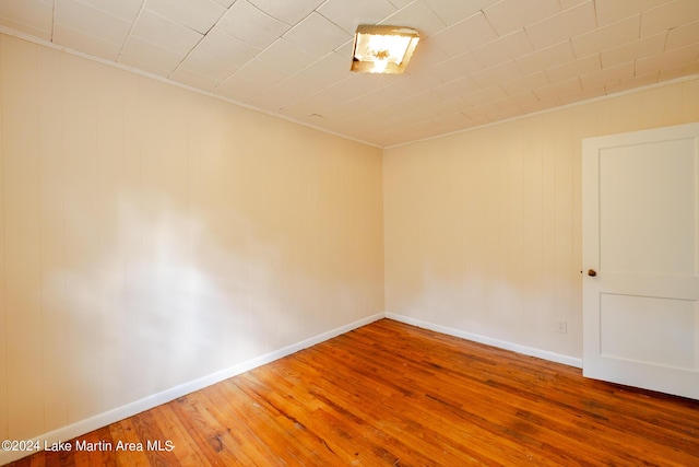 spare room with hardwood / wood-style floors