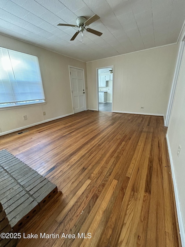 interior space featuring ceiling fan and wood-type flooring