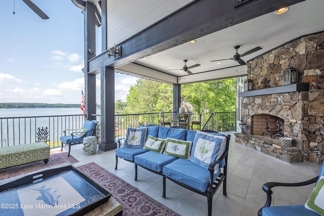 1071 Trillium W Pkwy, Eclectic, AL 36024 - view of patio / terrace with a water view, a ceiling fan, and an outdoor living space with a fireplace