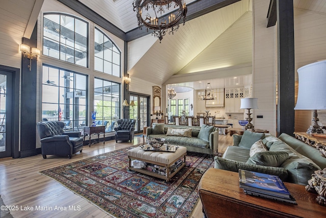 1071 Trillium W Pkwy, Eclectic, AL 36024 - living room featuring wood finished floors, a chandelier, and high vaulted ceiling