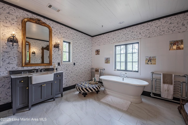 1071 Trillium W Pkwy, Eclectic, AL 36024 - bathroom with visible vents, ornamental molding, vanity, wallpapered walls, and a freestanding bath
