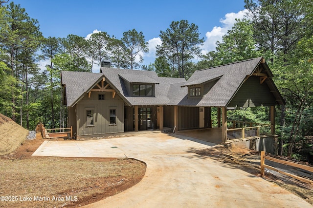 74 Cedar Rdg, Alexander City, AL 35010 - view of front of property with a shingled roof, driveway, a chimney, board and batten siding, and french doors