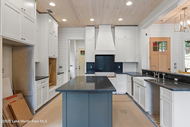 74 Cedar Rdg, Alexander City, AL 35010 - kitchen with custom exhaust hood, wood ceiling, recessed lighting, backsplash, and a sink