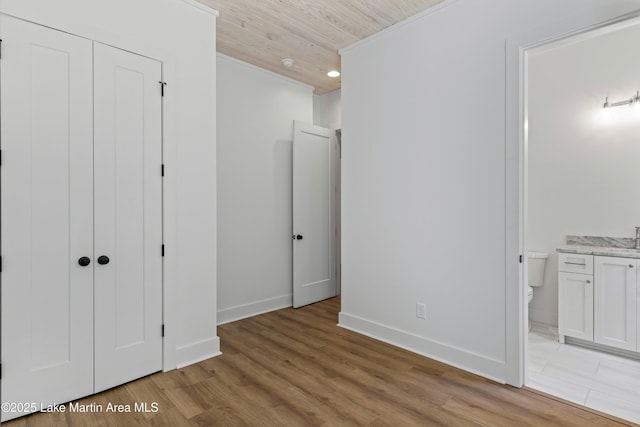 74 Cedar Rdg, Alexander City, AL 35010 - unfurnished bedroom with light wood-style floors, ensuite bath, wooden ceiling, and a closet
