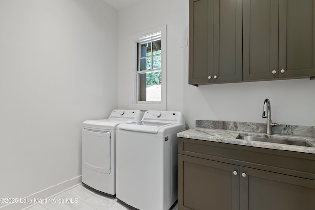 74 Cedar Rdg, Alexander City, AL 35010 - laundry room featuring cabinet space, washer and clothes dryer, and light tile patterned floors
