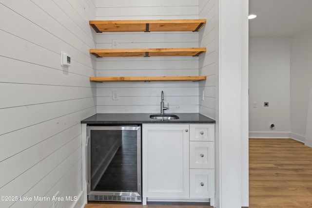74 Cedar Rdg, Alexander City, AL 35010 - indoor wet bar featuring wine cooler, wood finished floors, and wooden walls