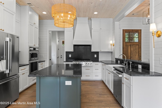 74 Cedar Rdg, Alexander City, AL 35010 - kitchen featuring appliances with stainless steel finishes, wood ceiling, custom exhaust hood, backsplash, and recessed lighting