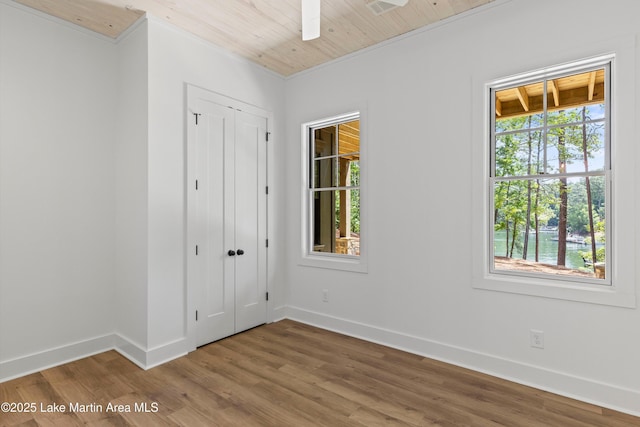74 Cedar Rdg, Alexander City, AL 35010 - unfurnished bedroom with wood finished floors, a closet, and a ceiling fan