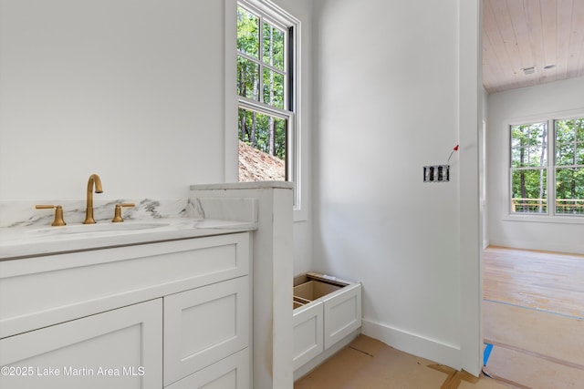 74 Cedar Rdg, Alexander City, AL 35010 - bathroom featuring wooden ceiling, baseboards, and vanity