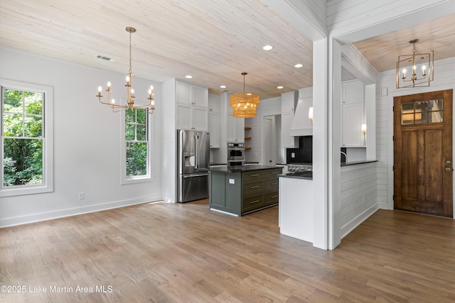74 Cedar Rdg, Alexander City, AL 35010 - kitchen with a chandelier, appliances with stainless steel finishes, dark countertops, wood finished floors, and wooden ceiling