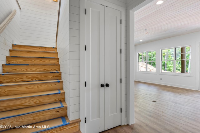 74 Cedar Rdg, Alexander City, AL 35010 - stairway featuring wood finished floors, baseboards, and wood walls