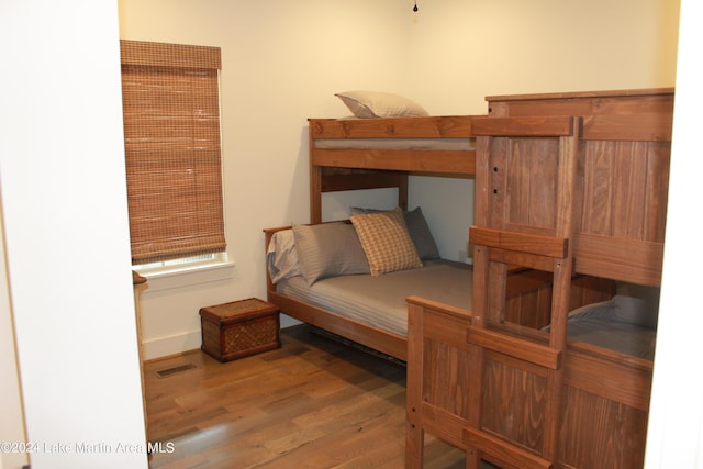 bedroom with hardwood / wood-style floors