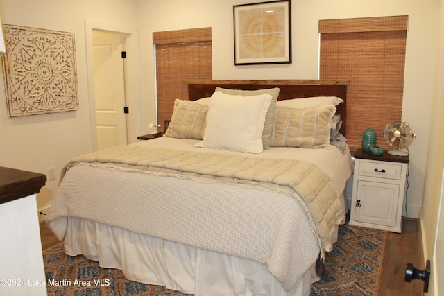 bedroom featuring dark wood-type flooring