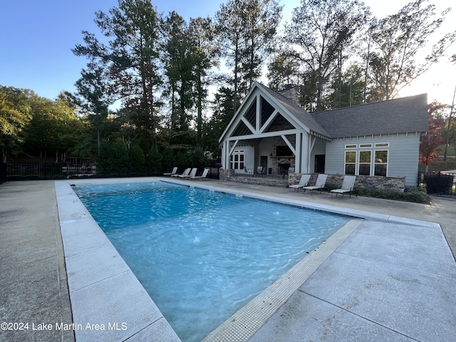 view of swimming pool with a patio area