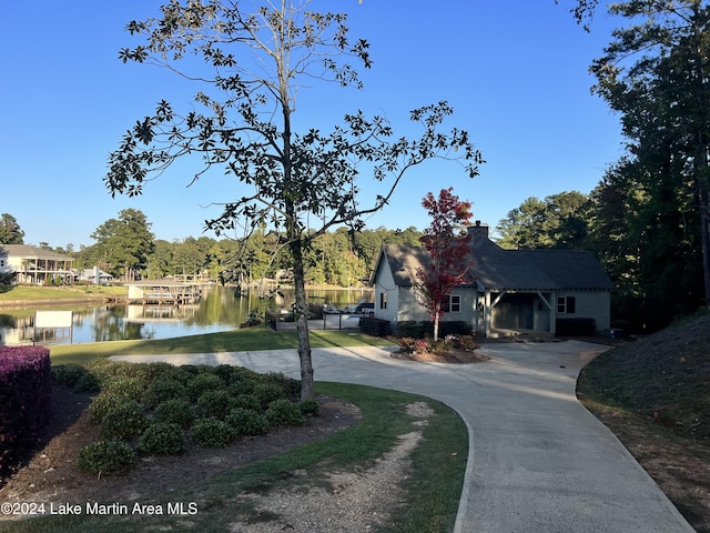 surrounding community with a water view