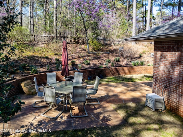 view of patio / terrace with outdoor dining space and a fenced backyard