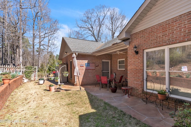 view of yard with a patio and fence