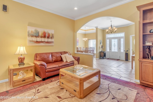 living area featuring light tile patterned floors, arched walkways, an inviting chandelier, and ornamental molding