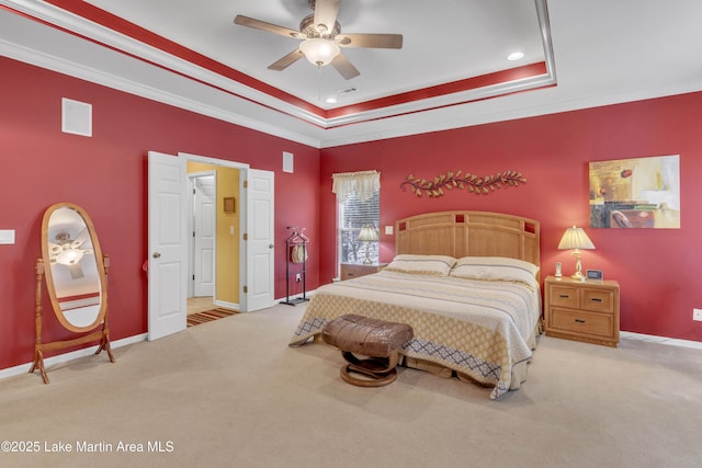 carpeted bedroom featuring recessed lighting, baseboards, a raised ceiling, and ornamental molding