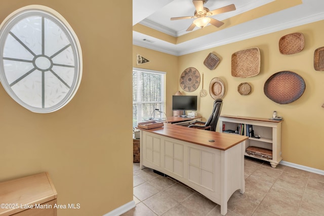 office with visible vents, ornamental molding, a ceiling fan, baseboards, and a raised ceiling