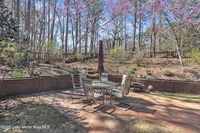 view of patio / terrace with outdoor dining space and fence