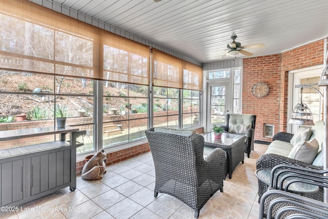 sunroom / solarium with a ceiling fan