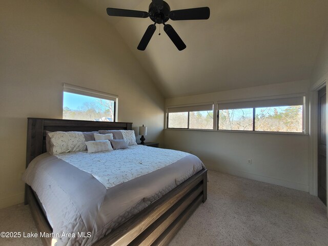 carpeted bedroom featuring ceiling fan and lofted ceiling