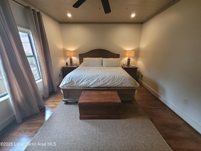 bedroom featuring ceiling fan and dark hardwood / wood-style floors