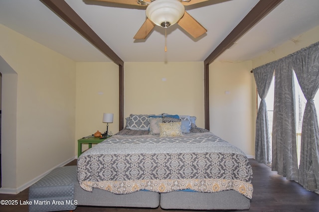 bedroom featuring a ceiling fan, baseboards, and wood finished floors