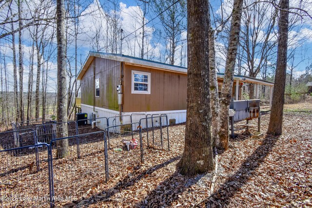 rear view of house featuring a deck