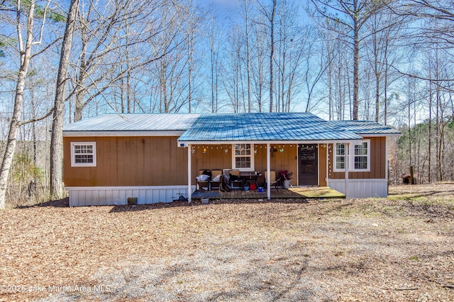 manufactured / mobile home with metal roof and a porch