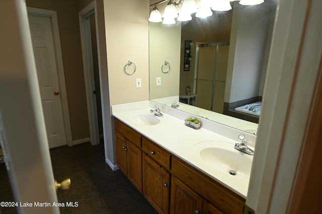 bathroom featuring vanity, tile patterned floors, and independent shower and bath