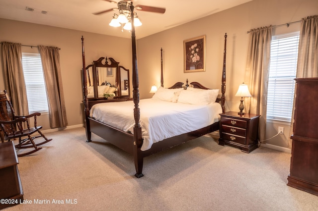 bedroom with light carpet and ceiling fan