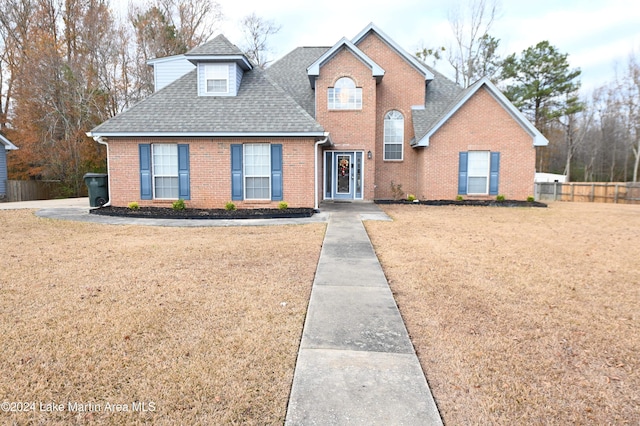 front facade with a front yard