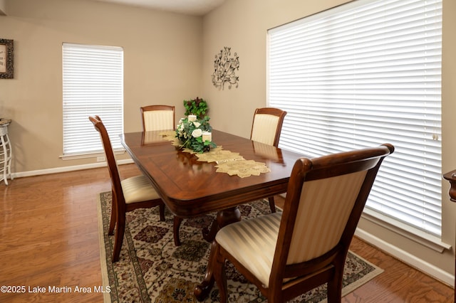 dining area with hardwood / wood-style floors