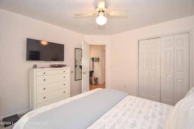 bedroom featuring ceiling fan and a closet