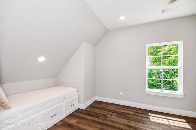 bonus room with vaulted ceiling, dark wood-type flooring, baseboards, and recessed lighting