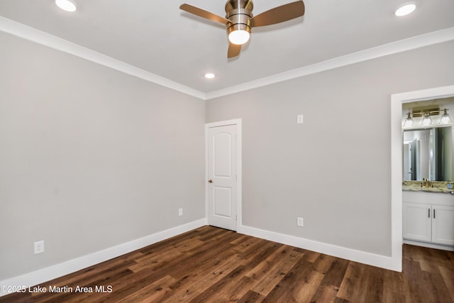 unfurnished room featuring ceiling fan, dark wood finished floors, baseboards, recessed lighting, and ornamental molding