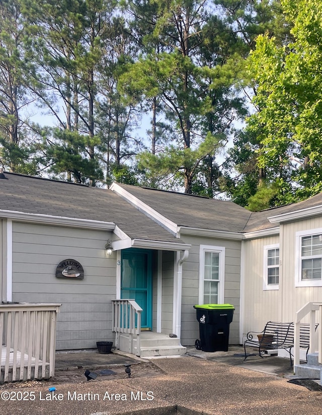 11 Redbud Ct, Dadeville, AL 36853 - doorway to property featuring roof with shingles